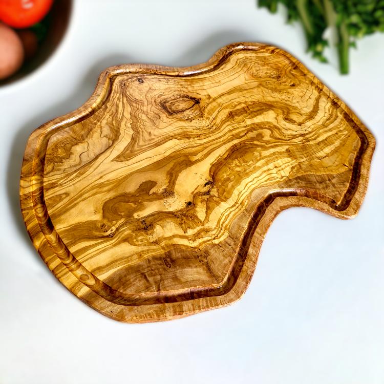 irregular shaped cutting board made of olive wood