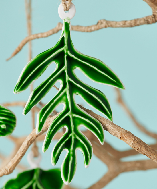 Green botanical leaf enamel hanging decoration with silver-coloured vein details and jute cord