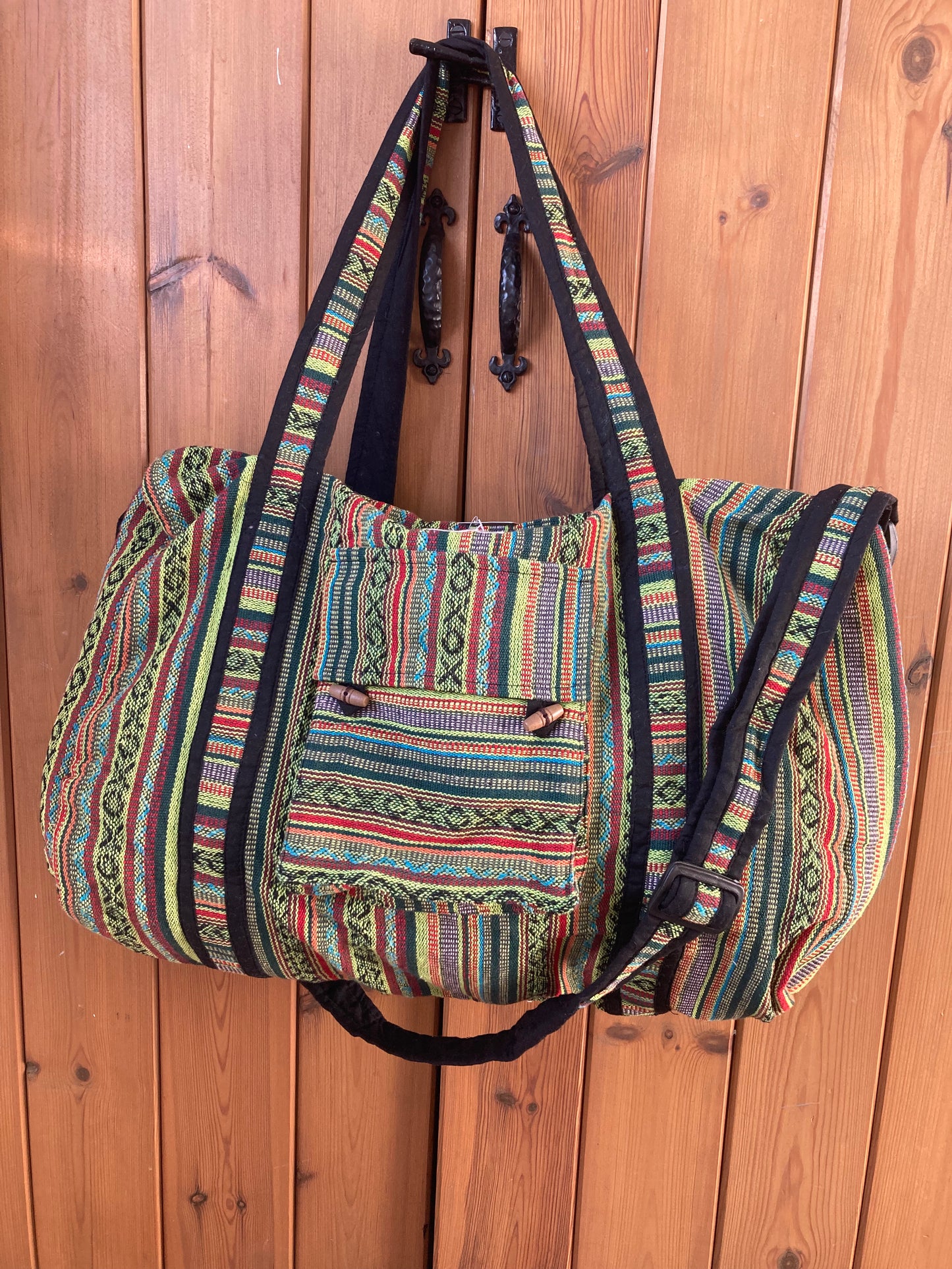 Ethically made striped weekend bag with traditional Nepali pattern