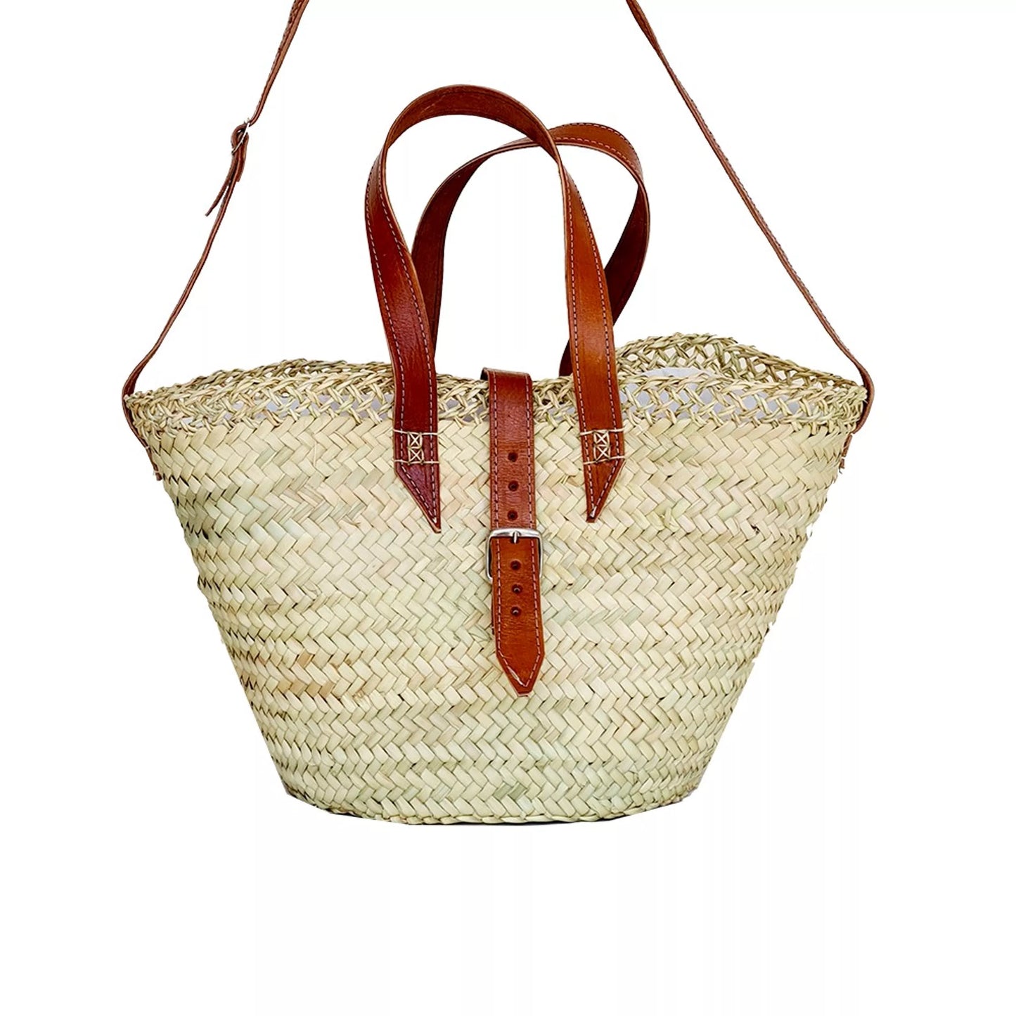 A tote basket made of palm fiber, featuring a caramel leather handle and shoulder strap, with a pouch closure and zip pocket.