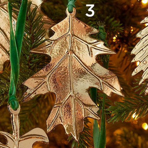 Recycled aluminium gold leaf ornament with green velvet string