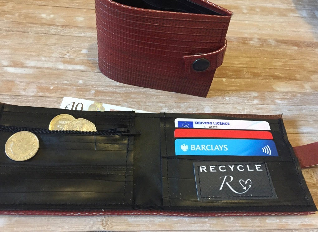 Water‑resistant wallet made from reclaimed fire hose