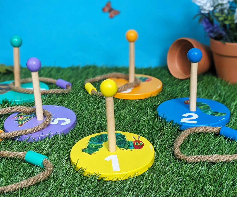 The Very Hungry Caterpillar wooden ring toss game with colourful targets and five rope rings