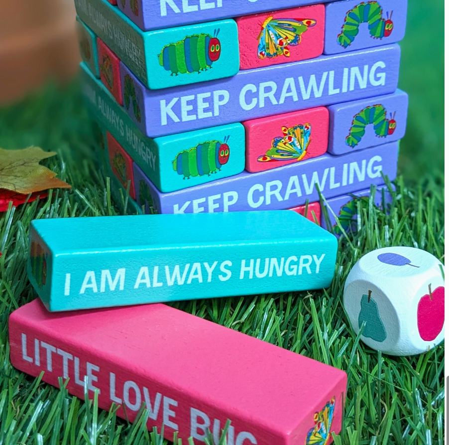 wooden tumble tower stacking game with colourful blocks and dice